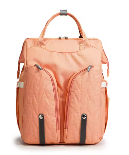 Sac à langer avec lit d'appoint intégré, poches isothermes et grand espace de rangement.